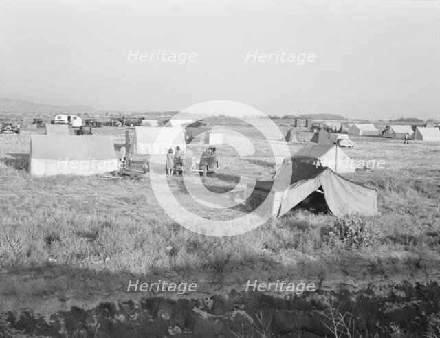 Families camped on flat before season opens waiting..., near Merrill, Klamath County, Oregon, 1939. Creator: Dorothea Lange.