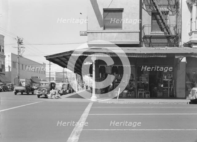 Street corner of San Joaquin Valley town on U.S. 99 showing secondhand store, Fresno, CA, 1939. Creator: Dorothea Lange.