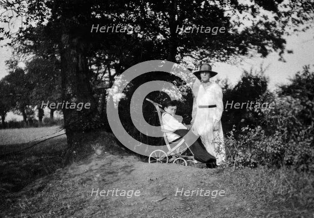 A physically disabled boy sitting in a wheelchair,  c1910/1925. Creator: Unknown.
