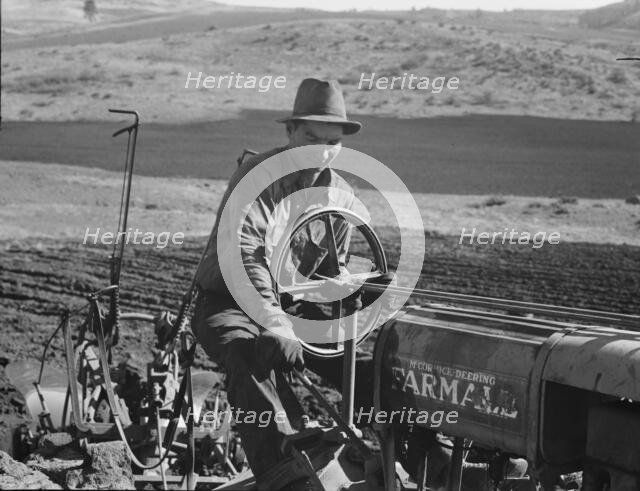 Young Idaho farmer plowing...Ola self-help sawmill co-op..., Gem County, Idaho, 1939. Creator: Dorothea Lange.