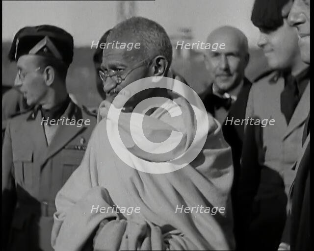 Mahatma Gandhi Standing with Others, 1930s. Creator: British Pathe Ltd.