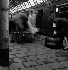 Travellers boarding a train to Rotterdam, Centraal Station, Amsterdam, Netherlands, 1963. Artist: Michael Walters