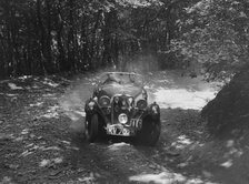 Singer Le Mans competing in the Brighton & Hove Motor Club Brighton-Beer Trial, 1934. Artist: Bill Brunell.