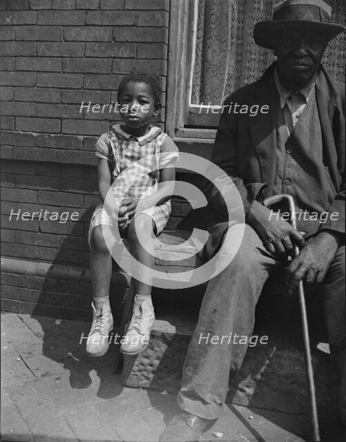 Grandfather and grandchild who live on Seaton Road, Washington, D.C, 1942. Creator: Gordon Parks.