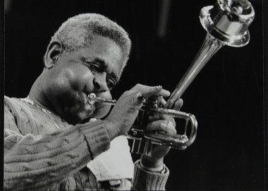 Thumbnail image of Dizzy Gillespie performing with the Royal Philharmonic Orchestra, Royal Festival Hall, London, 1985. Artist: Denis Williams