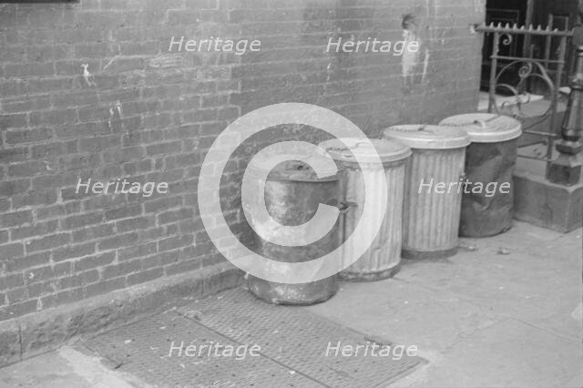 Garbage cans, 61st Street between 1st and 3rd Avenues, New York, 1938. Creator: Walker Evans.