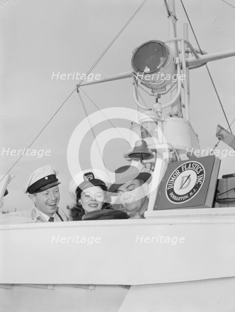 Portrait of Cliff Edwards, Betty Brewer, and Frank...Ukelele Lady (yacht), Hudson River, N.Y., 1947. Creator: William Paul Gottlieb.