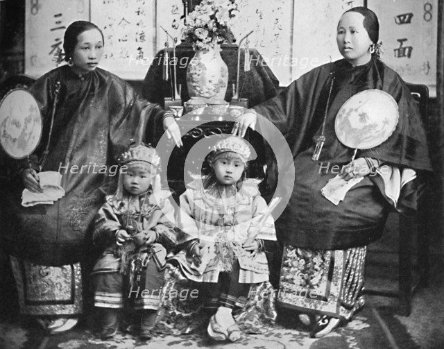 A family group of a prosperous Chinese merchant, 1902. Artist: CC Pierce & Co.