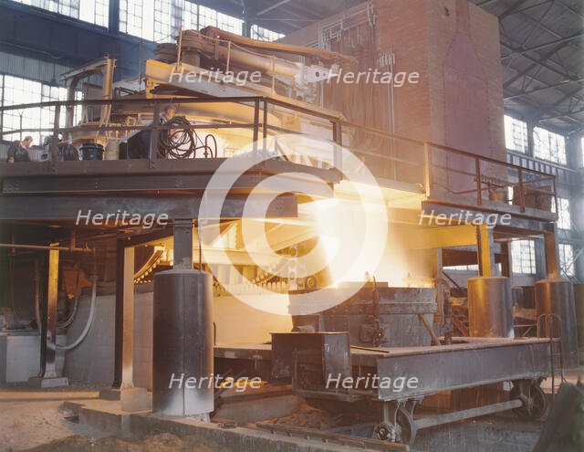 White-hot steel pours like water from a 35-ton electric furnace, Allegheny Ludlum Steele..., (1941?) Creator: Alfred T Palmer.