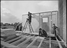 Workmen assembling a Swedish prefabricated house, 1945. Creator: Ministry of Works.