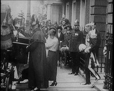 The Duke of York and Lady Elizabeth Bowes-Lyon Emerging from a House and Embarking on a..., 1920. Creator: British Pathe Ltd.