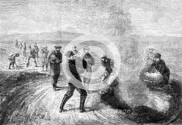 The Tourist in Iceland: feeding the Strökr, or Churn Geysir, 1881. Creator: Unknown.