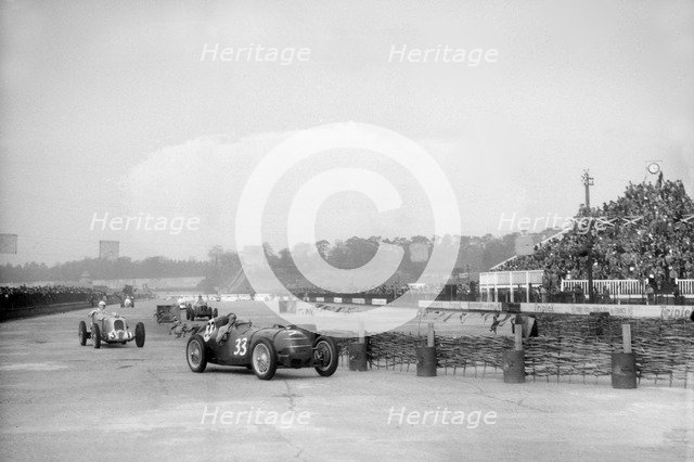 Riley 1985 cc leading MG K3 Magnette, JCC International Trophy, Brooklands, 2 May 1936. Artist: Bill Brunell.
