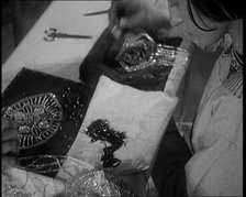 Young Female Civilian Embroidering a Piece of Fabric in an Arts Class, 1920. Creator: British Pathe Ltd.
