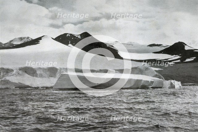 'A Berg Calving from a Glacier at Cape Crozier', c1911, (1913). Artist: Herbert Ponting.