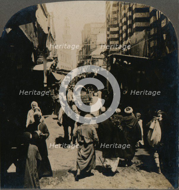 'On El Choir, a Narrow Street in the Arab Bazaar Quarter of Cairo, Egypt', 1903. Artist: Unknown.