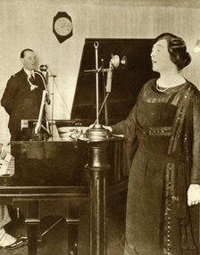 Performers singing a duet in one of the studios of 2LO, Savoy Hill, London, 1923, (1935). Creator: Unknown.
