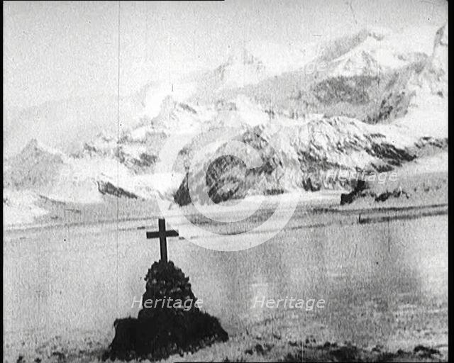 Sir Ernest Shackleton's Grave, Marked with a Cross, on South Georgia Island, 1922. Creator: British Pathe Ltd.