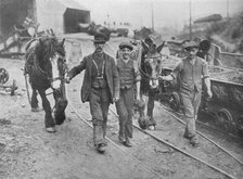 'After the settlement: Miners taking their ponies back to the pit', 1915. Artist: Unknown.