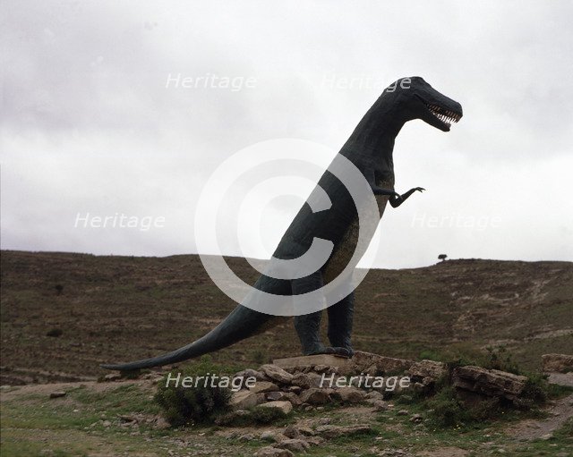 Reproduction of a dinosaur at the footprints site of such animals.