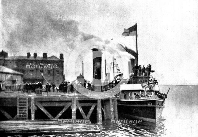 Lord Charles Beresford's party at Portsmouth: M.P.s...en route for Whale Island, 1898. Creator: Russell & Sons.