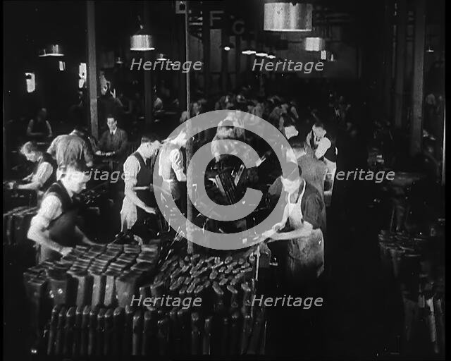 Men Working in a Factory, 1940. Creator: British Pathe Ltd.