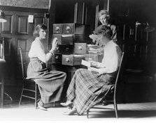 Three women work at the card index files at the headquarters of the National Woman's Party, c.1920.