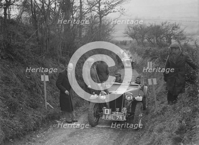 MG TA of Maurice Toulmin of the Cream Cracker Team at the MG Car Club Midland Centre Trial, 1938. Artist: Bill Brunell.