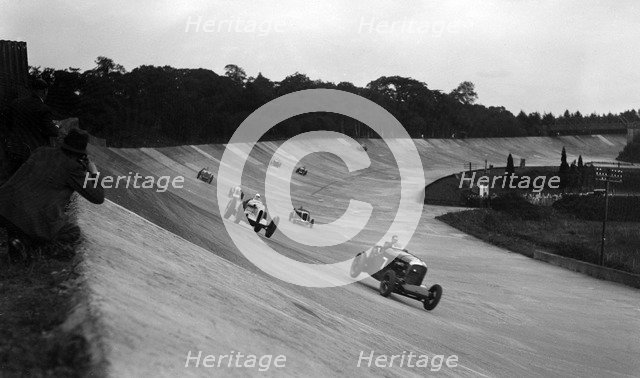Bentley leading a Barnato-Hassan Special and a Jensen, October Long Handicap, Brooklands, 1938. Artist: Bill Brunell.