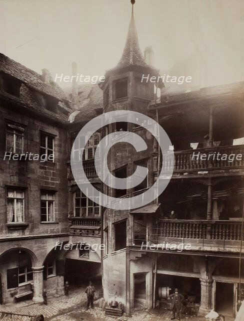 Untitled [courtyard with balconies and spiral staircase], 1870s.  Creator: Unknown.
