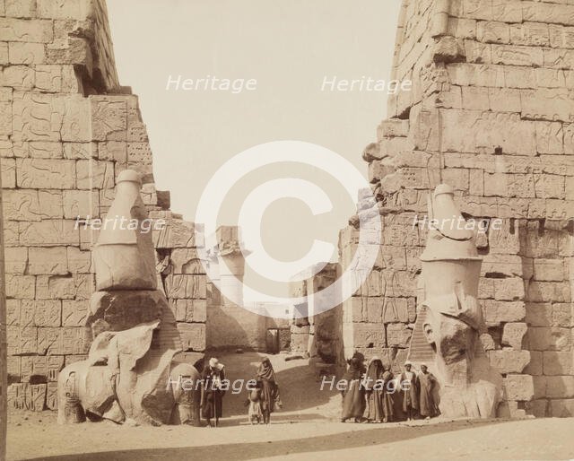 Entrance to Temple of Luxor with Colossal Statues of Luxor, East Bank Ramesses, between 1860 & 1903. Creator: Antonio Beato.