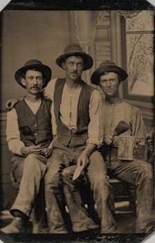 Three Painters, with Brushes and a Can of Paint, in Front of a Painted Window Backdrop, 1870s-80s. Creator: Unknown.