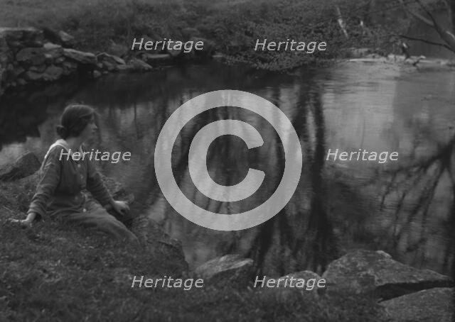 Millay, Edna St. Vincent, Miss, seated next to a pond, 1914. Creator: Arnold Genthe.