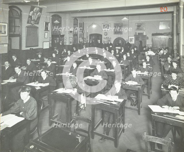 Examination class for male and female students, Queen's Road Evening Institute, London, 1908. Artist: Unknown.
