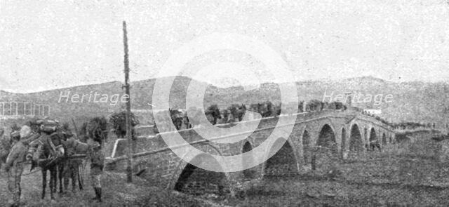 ''La rupture des lignes Bulgares; La traversee du grand pont de pierre sur la Bregalnitza..., 1918. Creator: Unknown.