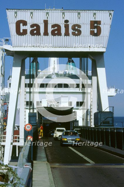 Cars boarding ferry at Calais. Artist: Unknown.