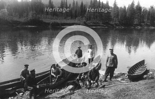 Topographers by the Boats on the Mrassu River Shore, Near the Ust'-Kabyrza Ulus, 1913. Creator: GI Ivanov.