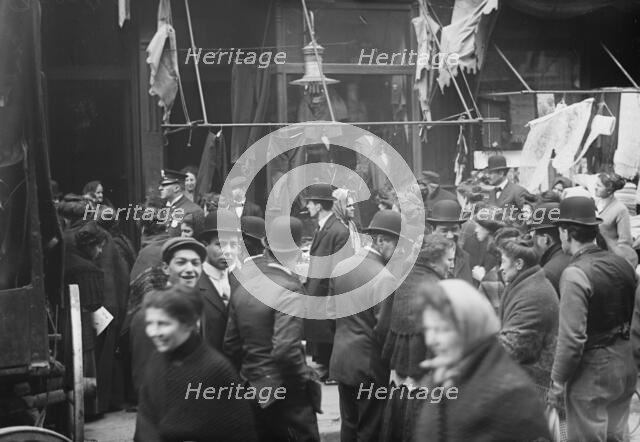 East side crowd discussing price of meat in front of shops, New York, 1910. Creator: Bain News Service.