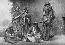 A Bedouin musician and his audience, 1902. Artist: Unknown.