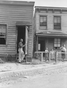 Twelve dollars a month for three rooms, Housing, Richmond, Virginia. , 1938. Creator: Dorothea Lange.
