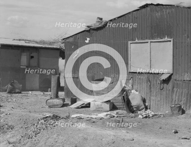 Housing for migratory cotton field laborers near Casa Grande, Arizona, 1937. Creator: Dorothea Lange.