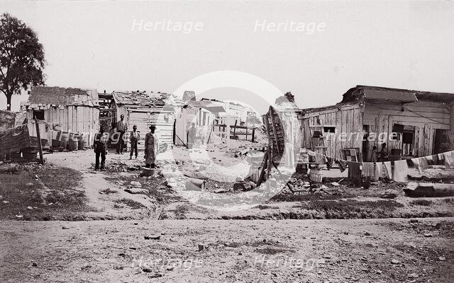 [Encampment with shacks and laundry]. Brady album, p. 129, 1861-65. Creator: Unknown.