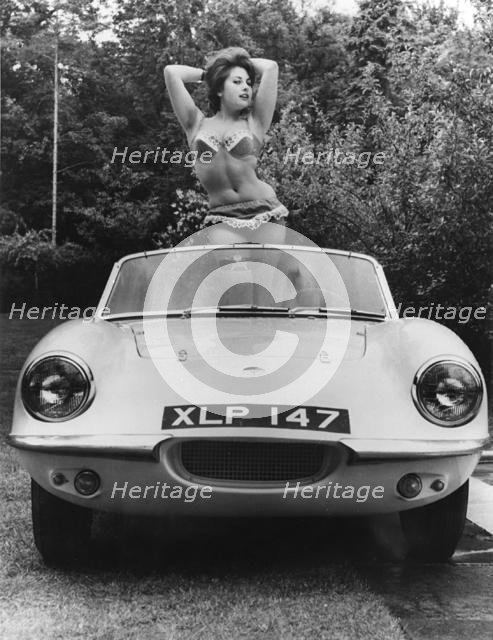1959 Elva with posing female model. Creator: Unknown.