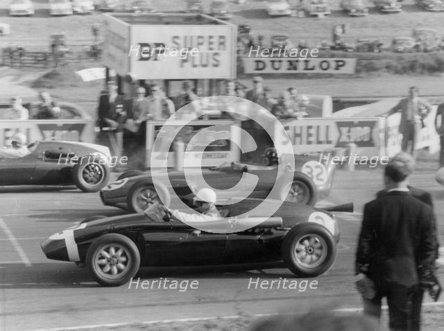 1959 Stirling Moss  in Cooper Borgward, next to Graham Hill in Lotus Climax. Creator: Unknown.