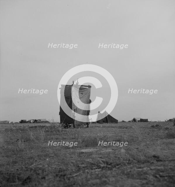 Unsanitary privy in potato pickers' camp near Shafter, California, 1937. Creator: Dorothea Lange.