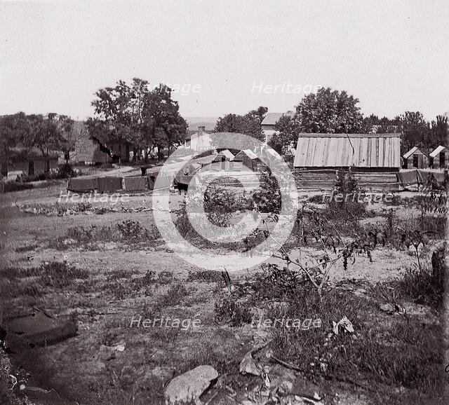 [View of a small town with wooden sheds in distance]. Brady album, p. 123, 1861-65. Creator: Unknown.