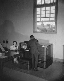 Broadcast tower at Howard University during commencement exercises, Washington, D.C, 1942. Creator: Gordon Parks.