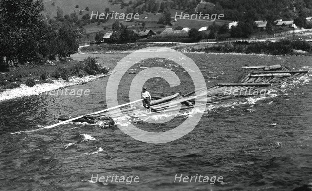 Floating tree trunks down the river, Bistrita Valley, Moldavia, north-east Romania, c1920-c1945. Artist: Adolph Chevalier