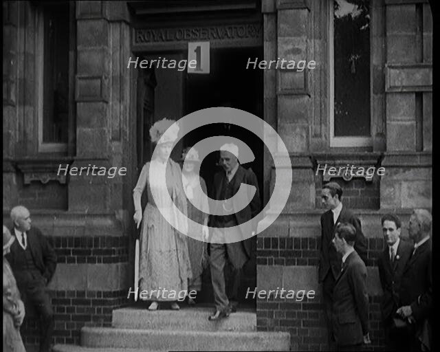 Queen Mary Accompanied by a Group of Officials Emerging from a Building , 1924. Creator: British Pathe Ltd.