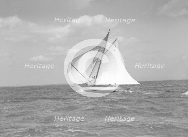 The 8 Metre class 'Norman' (H1) running  downwind in a good breeze, 1911. Creator: Kirk & Sons of Cowes.